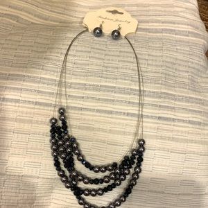 Brand new. With tags.Necklace and earrings set.